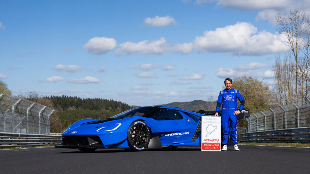 Picture of Ford GT Mk IV with driver Frédéric Vervisch and timing board showing the new lap record for a petrol vehicle. The lap record was set at 6.15.977
